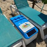 LounGenie amenity between two lounge chairs inside the resort's poolside cabana