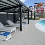 Poolside cabanas equipped with LounGenie amenity units