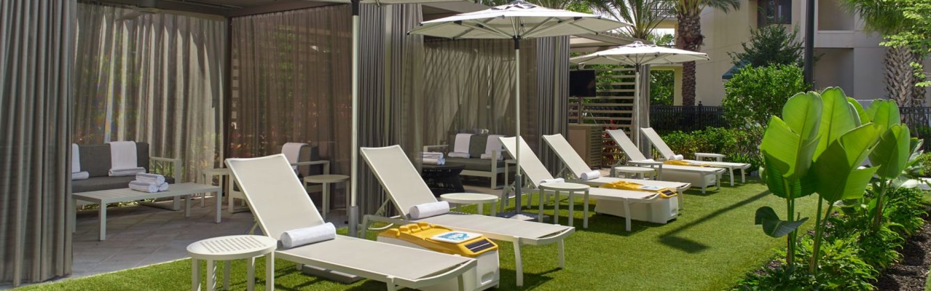 Cabana with LounGenie smart amenity unit installed poolside