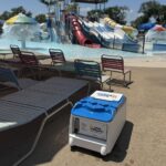 LounGenie smart unit with charging and safe in theme park cabana