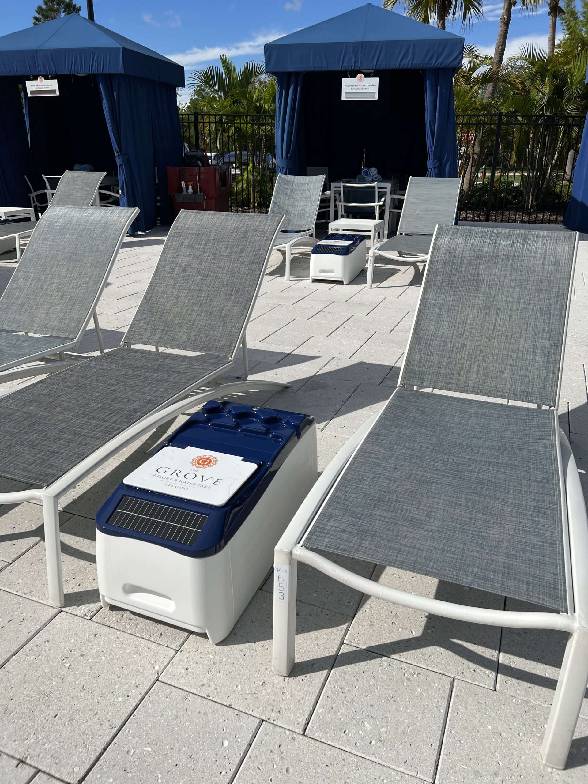 LounGenie safe and charging ports close-up in cabana and LounGenie cabana unit showing waterproof safe and USB ports